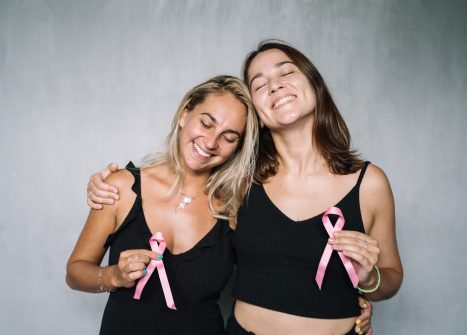 Two girls with cancer ribbons